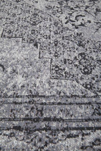 grijs vloerkleed vintage sabari detail hoek